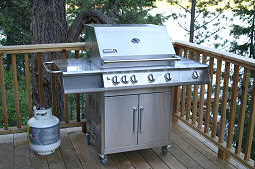 Cook delicious meals out on the upper deck with the gas grill while enjoying the view! Hayden Lake House Vacation Rental, Hayden Lake, Idaho
