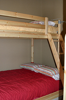 The lower bunk on the left side of the room is a double bed. The others are twin beds. Hayden Lake House Vacation Rental, Hayden Lake, Idaho