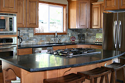 The breakfast counter is great for talks during meal preparations or as extra seating. Hayden Lake House Vacation Rental, Hayden Lake, Idaho
