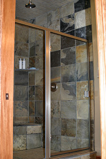 Walk-in slate shower with multiple shower heads and bench with heated slate floors! Hayden Lake House Vacation Rental, Hayden Lake, Idaho